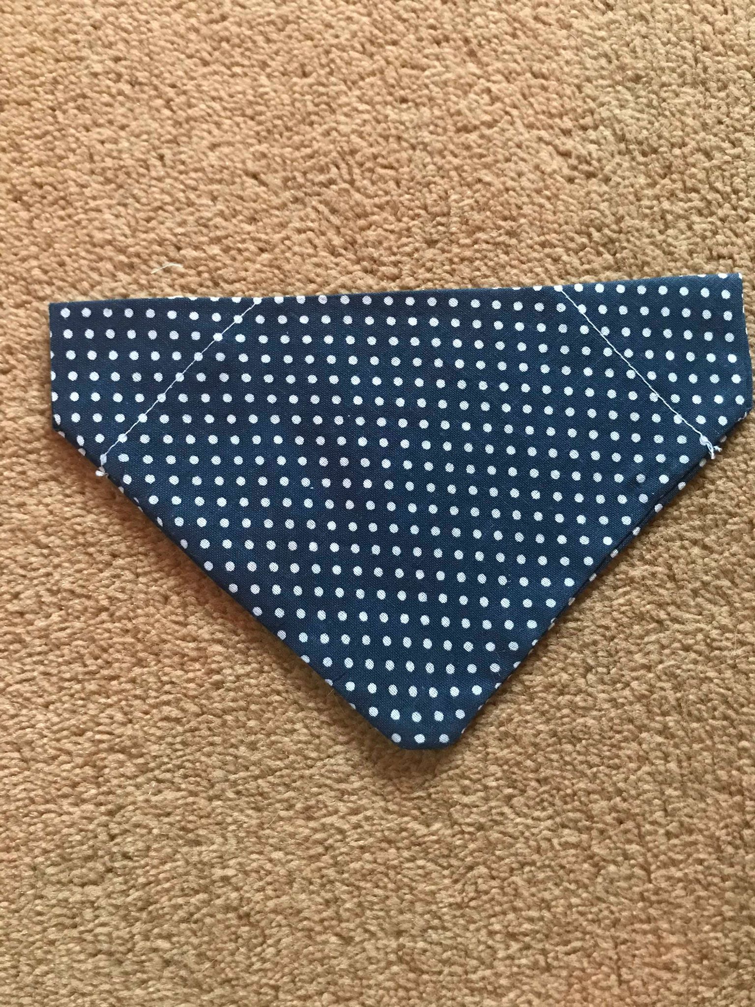 White polka dots on navy